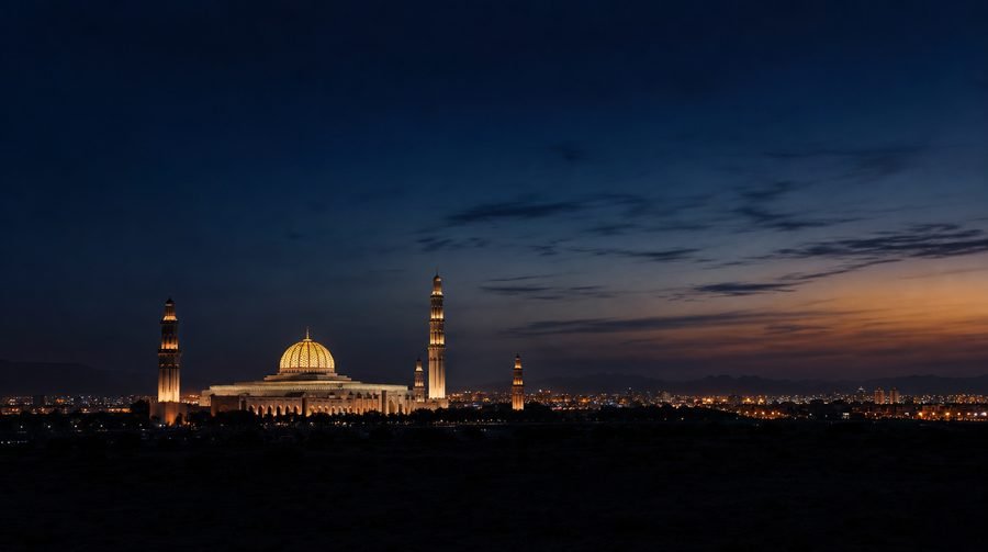 Muscat skyline at dusk with the Grand Mosque silhouette